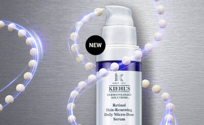 Image of Kiehl's Retinol Skin-Renewing Daily Micro-Dose Serum bottle surrounded by a glowing, abstract representation of molecules, with a "NEW" label in the top corner.