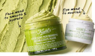 Close-up of two skincare products: a green jar labeled "Avocado Nourishing Hydration Mask" for smoothing and hydrating the skin, and a white jar labeled "Creamy Eye Treatment" for nourishing the eye area, set against a textured green backdrop.