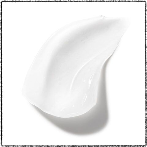 A smooth, white blob of cream or lotion on a white background.