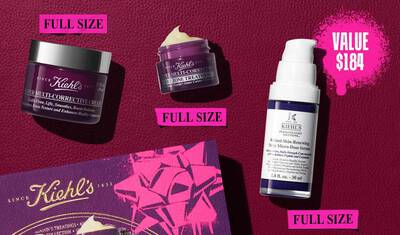 Une image presente trois produits Kiehl's et une boite cadeau sur un fond rouge fonce avec des elements graphiques rose vif. Un pot violet de "Kiehl's SUPER MULTI-CORRECTIVE CREAM" est a gauche, etiquete "FULL SIZE" dans un cadre rose. Au-dessus se trouve un pot violet plus petit de "Kiehl's SUPER MULTI-CORRECTIVE EYE ZONE TREATMENT", egalement etiquete "FULL SIZE" dans un cadre rose en dessous. A droite, une bouteille blanche et violette de "KIEHL'S Retinol Skin-Renewing Daily Micro-Dose Serum" est visible, avec un cadre rose en dessous indiquant "FULL SIZE". Une plus grande eclaboussure graphique rose dans le coin superieur droit annonce "VALUE $184".
