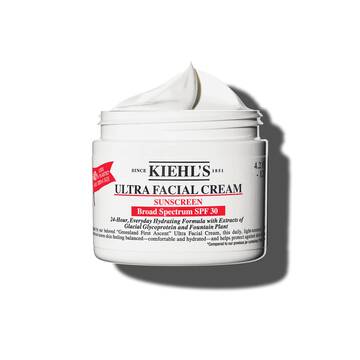 Een pot van 125 ml Kiehl's Ultra Facial Cream SPF 30 met opgeklopte textuur tegen een witte achtergrond.