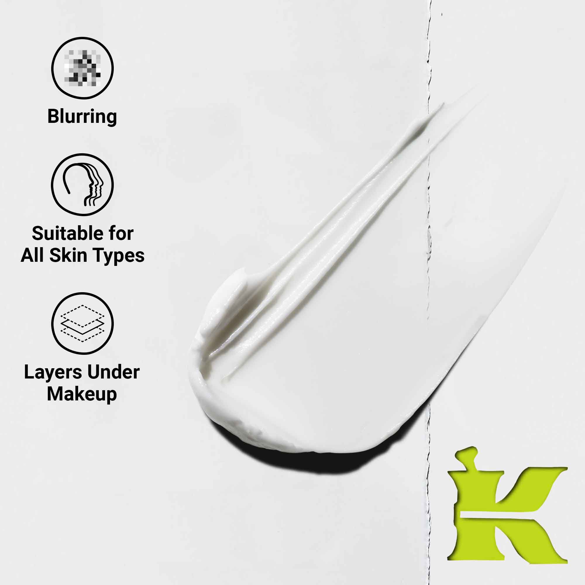 A close-up of a white cream texture with three icons and claims: “Blurring,” “Suitable for All Skin Types,” and “Layers Under Makeup.” A green Kiehl’s “K” logo is in the bottom right corner.