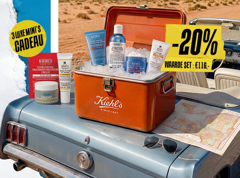 Kiehl's Oil-Free Essentials set in een vintage koelbox op een blauwe auto, omringd door ijs en een landkaart.