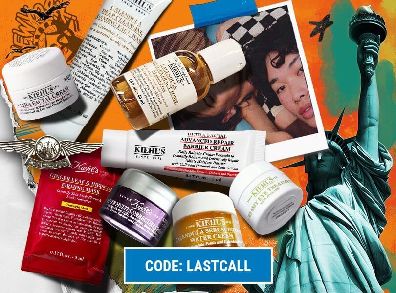 Un assortiment de produits de soin Kiehl's disposés artistiquement sur un fond orange vif représentant la Statue de la Liberté.