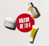 Trois produits de soin pour la peau Kiehl's en format voyage (la crème Ultra Facial Cream, la lotion Calendula Herbal-Extract Toner et le soin contour des yeux Avocado Eye Cream) sont disposés sur un fond blanc texturé. Au centre, un cercle rouge peint à la brosse contient l'inscription en blanc 'WAARDE VAN €18'.